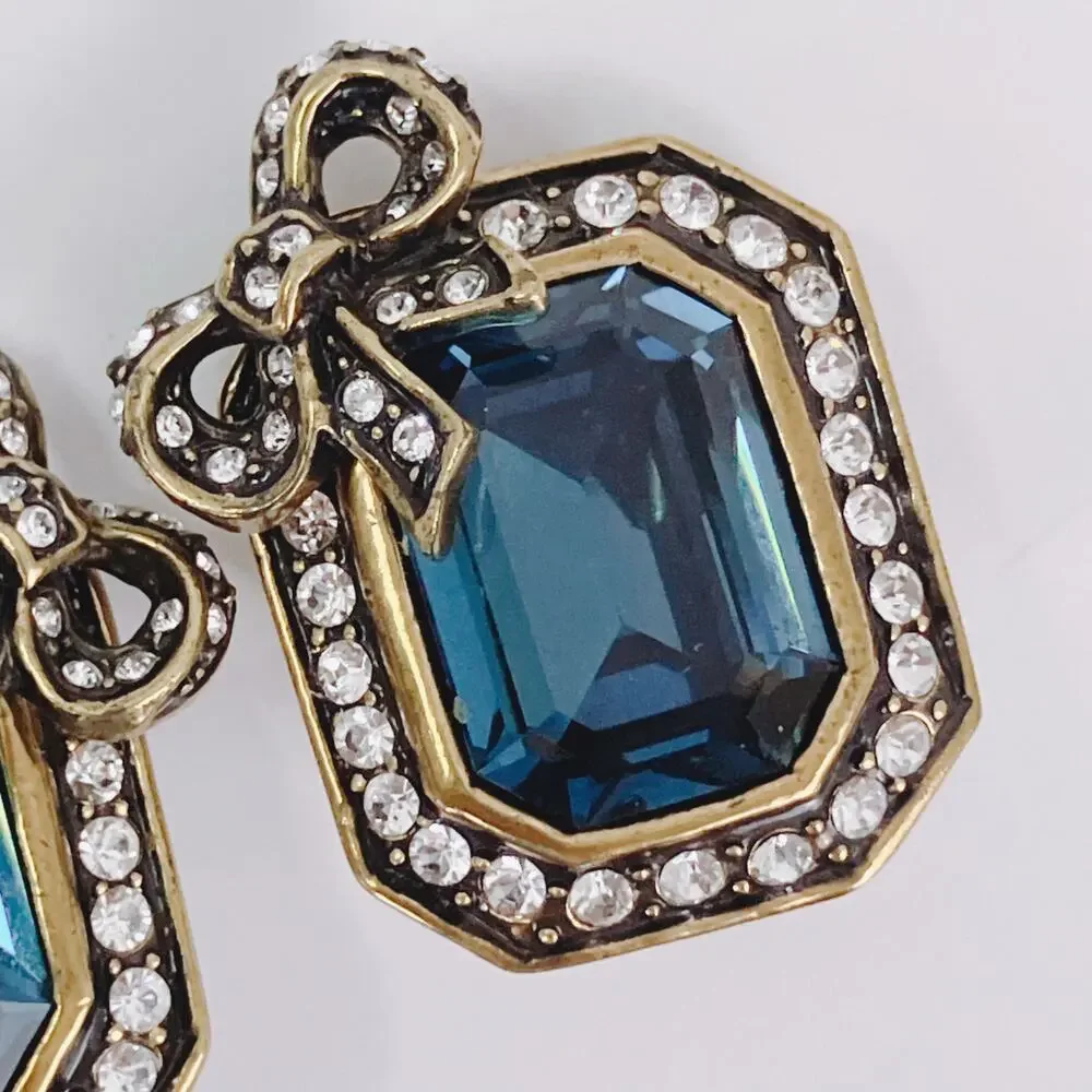 Vintage Signed Heidi Daus Blue Glass Bow Clip On Earrings Rhinestone Collectible